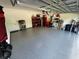 Garage with epoxy flooring, ample storage shelving, and overhead storage at 1554 Outback W Rd, St Cloud, FL 34771