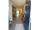 Bright and airy entryway with tile flooring and views into the living area at 1554 Outback W Rd, St Cloud, FL 34771