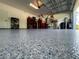 Garage boasts epoxy flooring and abundant storage solutions at 1554 Outback W Rd, St Cloud, FL 34771