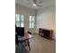 Home office with wood desk, mid-century modern credenza, and plantation shutters at 1554 Outback W Rd, St Cloud, FL 34771