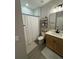 Clean bathroom with modern vanity, shower, and tile flooring at 1554 Outback W Rd, St Cloud, FL 34771