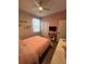 Light and airy bedroom with pink walls and ceiling fan at 1554 Outback W Rd, St Cloud, FL 34771