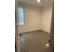 Spacious bedroom with gray tile flooring and plenty of natural light at 1554 Outback W Rd, St Cloud, FL 34771