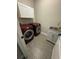 Bright laundry room, features washer, dryer, and utility sink at 1554 Outback W Rd, St Cloud, FL 34771