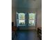 Home office featuring plantation shutters and views of the backyard at 1554 Outback W Rd, St Cloud, FL 34771