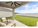 Relaxing covered patio overlooking a spacious backyard at 1554 Outback W Rd, St Cloud, FL 34771
