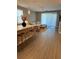Living room flows seamlessly into kitchen, featuring neutral color palette at 1554 Outback W Rd, St Cloud, FL 34771