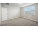 Simple bedroom with carpet, neutral walls, and a window at 1724 Forest Run Ln, Auburndale, FL 33823