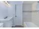 Clean bathroom with white vanity, bathtub, and tiled walls at 205 Elaine Pl, Chuluota, FL 32766