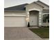 One-story house with a two-car garage and a double front door at 267 Doe Run Dr, Winter Garden, FL 34787