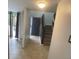 Bright entryway with staircase and tile flooring leading to the upper level at 4559 Tower Pine Rd # Ge, Orlando, FL 32839