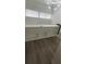 Loft area with built-in shelving and gray vinyl flooring at 4559 Tower Pine Rd # Ge, Orlando, FL 32839