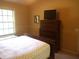 Spacious bedroom with a dresser and window at 549 Juniper Way, Tavares, FL 32778