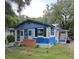Quaint fixer-upper home with blue siding and a spacious yard at 1805 W 15Th St # 1/2, Sanford, FL 32771