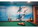 Game room with pool table and ocean-themed wall art at 2734 Oxymoron Way, Kissimmee, FL 34746