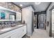 Bathroom with double vanity and ocean-themed decor at 2734 Oxymoron Way, Kissimmee, FL 34746