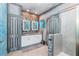 Bathroom with double vanity, walk-in shower, and nautical theme at 2734 Oxymoron Way, Kissimmee, FL 34746