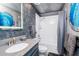 Bathroom with a tub, shower, and gray vanity at 2734 Oxymoron Way, Kissimmee, FL 34746