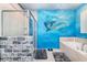 Bathroom with bathtub, walk-in shower, and dolphin mural at 2734 Oxymoron Way, Kissimmee, FL 34746