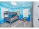 Bedroom with a bunk bed and ocean-themed murals at 2734 Oxymoron Way, Kissimmee, FL 34746