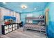 Bedroom with bunk bed, ocean mural, and workspace at 2734 Oxymoron Way, Kissimmee, FL 34746