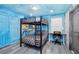 Bedroom with a bunk bed, workspace, and ocean mural at 2734 Oxymoron Way, Kissimmee, FL 34746