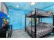 Fun bedroom with bunk beds and ocean mural at 2734 Oxymoron Way, Kissimmee, FL 34746