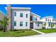 Two-story modern home with stone accents and landscaped yard at 2734 Oxymoron Way, Kissimmee, FL 34746