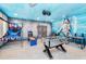 Fun game room, foosball table, arcade games, and shark mural at 2734 Oxymoron Way, Kissimmee, FL 34746