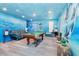 Game room with pool table and ocean-themed murals at 2734 Oxymoron Way, Kissimmee, FL 34746