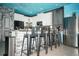 Modern kitchen with breakfast bar, stainless steel appliances and ocean-themed mural at 2734 Oxymoron Way, Kissimmee, FL 34746