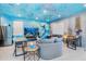 Living area with ocean mural and kitchen view at 2734 Oxymoron Way, Kissimmee, FL 34746