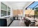 Modern outdoor kitchen with stainless steel appliances and granite countertops at 2734 Oxymoron Way, Kissimmee, FL 34746