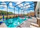 Screened-in pool with floats and basketball hoop at 2734 Oxymoron Way, Kissimmee, FL 34746