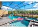 Inviting pool and spa area with screened enclosure, perfect for relaxation at 2734 Oxymoron Way, Kissimmee, FL 34746