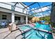 Inviting pool and spa area with screened enclosure, perfect for relaxation at 2734 Oxymoron Way, Kissimmee, FL 34746