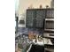 Kitchen with dark cabinets, patterned backsplash and stainless steel appliances at 345 Reserve Dr, Davenport, FL 33896