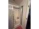 Clean bathroom with a shower and tile surround at 345 Reserve Dr, Davenport, FL 33896