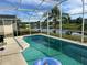 Relaxing screened-in pool with lake views at 345 Reserve Dr, Davenport, FL 33896