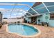 Screened pool area with brick pavers and seating area at 6019 Live Oak Dr, Winter Haven, FL 33880
