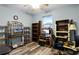 Home office with built-in shelving, desk, and ample workspace at 6019 Live Oak Dr, Winter Haven, FL 33880