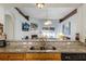 Kitchen features granite counters, a breakfast bar, and views of the living room and pool at 6019 Live Oak Dr, Winter Haven, FL 33880