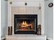 Inviting fireplace with a glass screen and wood burning at 6019 Live Oak Dr, Winter Haven, FL 33880