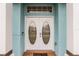 White double front doors with oval glass inserts at 6019 Live Oak Dr, Winter Haven, FL 33880