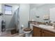 Bathroom with toilet, sink, shower, and granite countertop at 6019 Live Oak Dr, Winter Haven, FL 33880