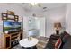 Bright Gathering room with wood-look floors, leather furniture, and views to another room at 6019 Live Oak Dr, Winter Haven, FL 33880