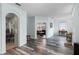 Open living area with wood-look floors, showing access to other rooms at 6019 Live Oak Dr, Winter Haven, FL 33880