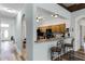 Kitchen with granite countertops, wooden cabinets, and a breakfast bar at 6019 Live Oak Dr, Winter Haven, FL 33880