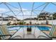 Screened pool and patio area with table and chairs at 6019 Live Oak Dr, Winter Haven, FL 33880
