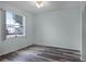 Spare bedroom with wood-look floors and a window at 6019 Live Oak Dr, Winter Haven, FL 33880